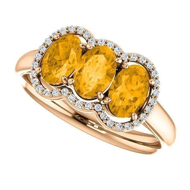 14KT GOLD 1.32 CTW CITRINE & 0.10 CTW DIAMOND 3 STONE OVAL HALO RING