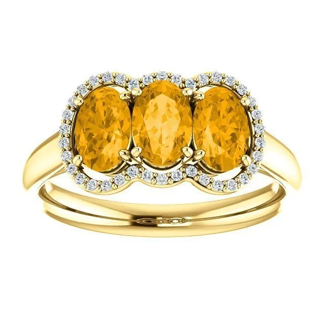 14KT GOLD 1.32 CTW CITRINE & 0.10 CTW DIAMOND 3 STONE OVAL HALO RING