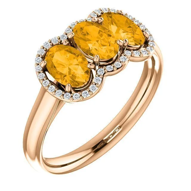 14KT GOLD 1.32 CTW CITRINE & 0.10 CTW DIAMOND 3 STONE OVAL HALO RING