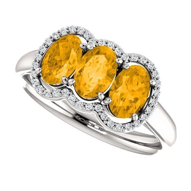 14KT GOLD 1.32 CTW CITRINE & 0.10 CTW DIAMOND 3 STONE OVAL HALO RING