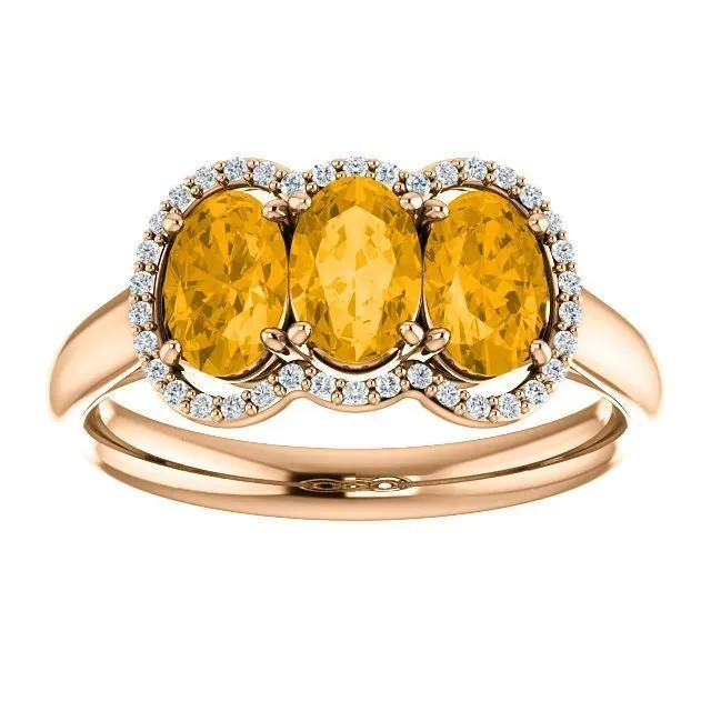 14KT GOLD 1.32 CTW CITRINE & 0.10 CTW DIAMOND 3 STONE OVAL HALO RING