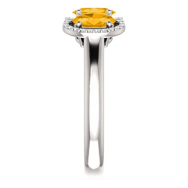14KT GOLD 1.32 CTW CITRINE & 0.10 CTW DIAMOND 3 STONE OVAL HALO RING