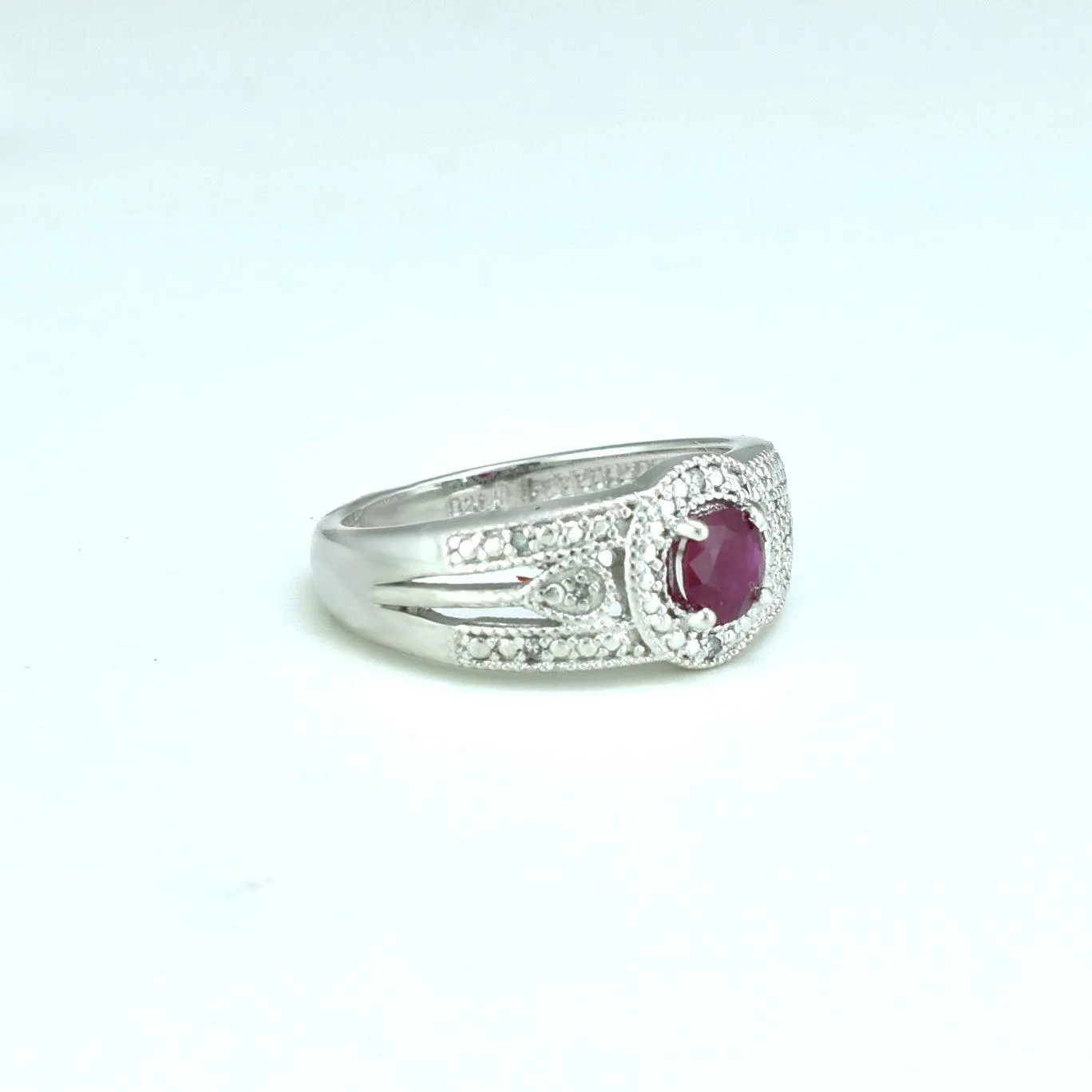 Genuine Ruby and Diamond Accent Fashion Ring in Silver
