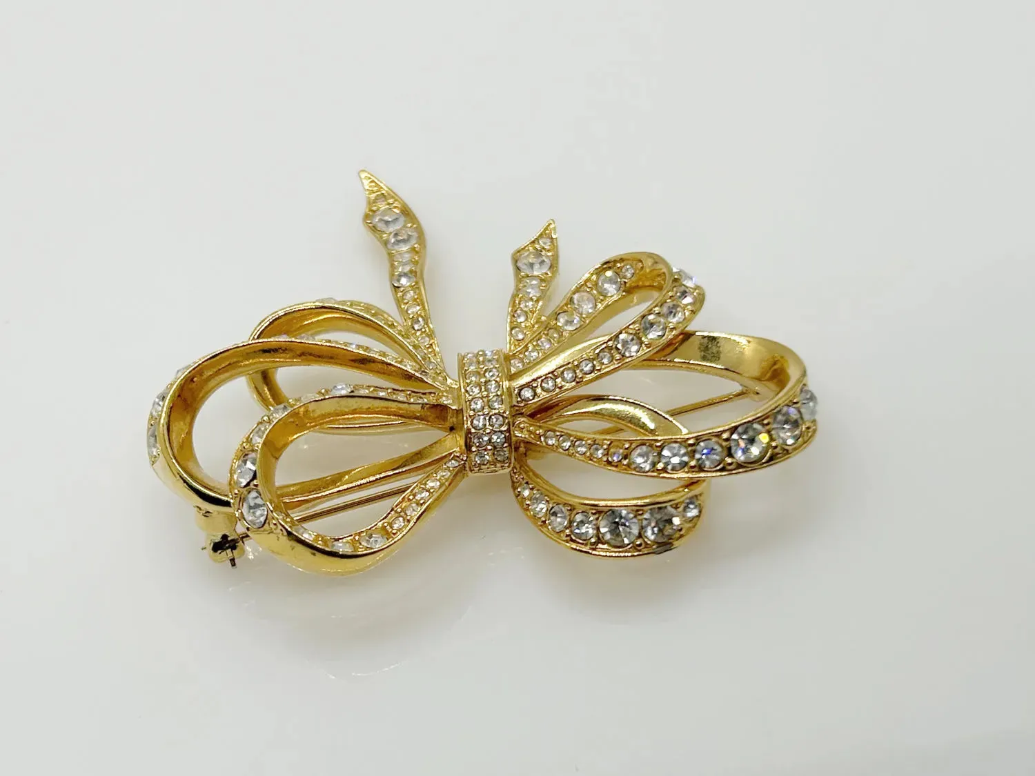 Vintage Flowing Rhinestone Ribbon Bow Brooch by Kenneth Jay Lane for Avon